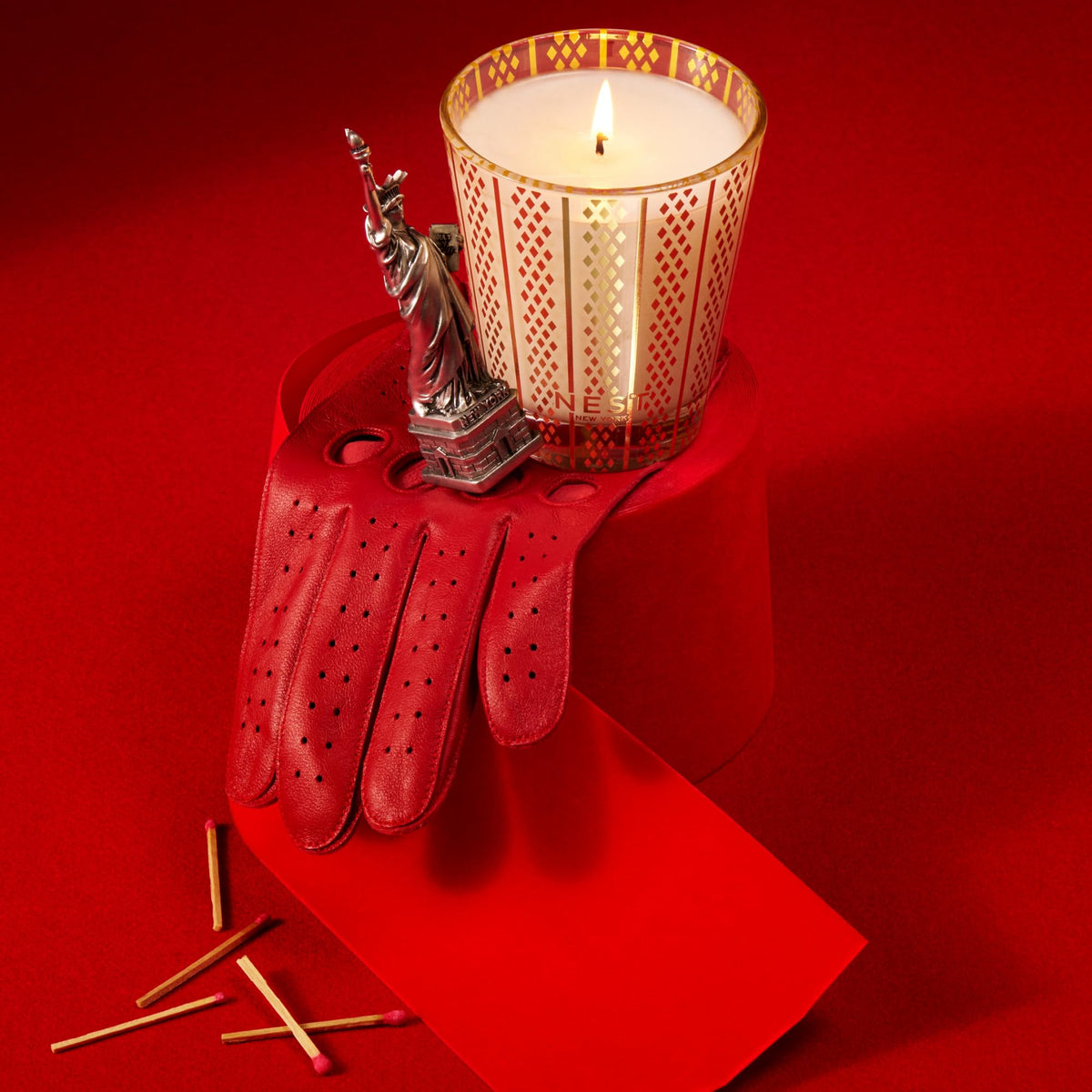 Nest New York candle with an etched gold pattern elevates decor while delivering refined fragrance