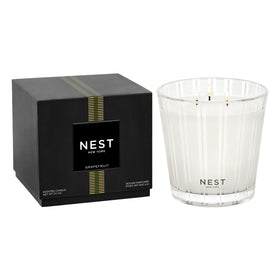 Nest New York Grapefruit candle in a glass vessel offers luxurious ambiance.