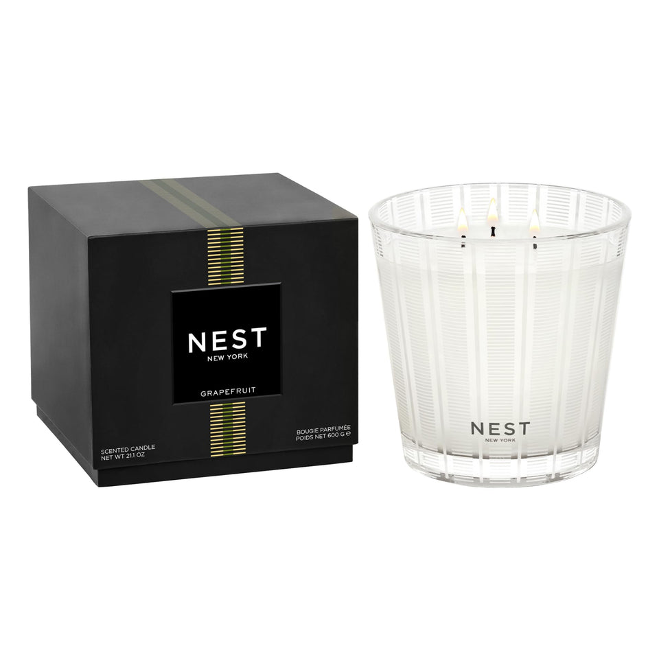 Nest New York Grapefruit candle in a glass vessel offers luxurious ambiance.