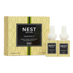 Nest New York grapefruit smart vial pour for Pura diffusers in a modern living room, long-lasting citrus ambiance
