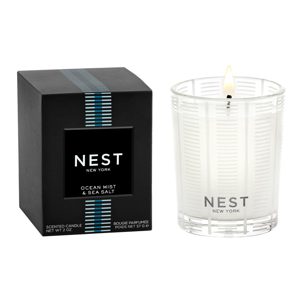 NEST New York Ocean Mist votive candle enhances living room ambiance with ocean-inspired serenity.