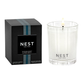 NEST New York Ocean Mist votive candle enhances living room ambiance with ocean-inspired serenity.