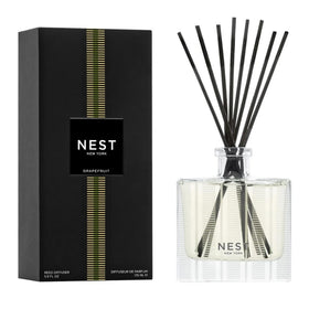 NEST New York Reed Diffuser bottle releasing grapefruit aroma for a subtle home fragrance.