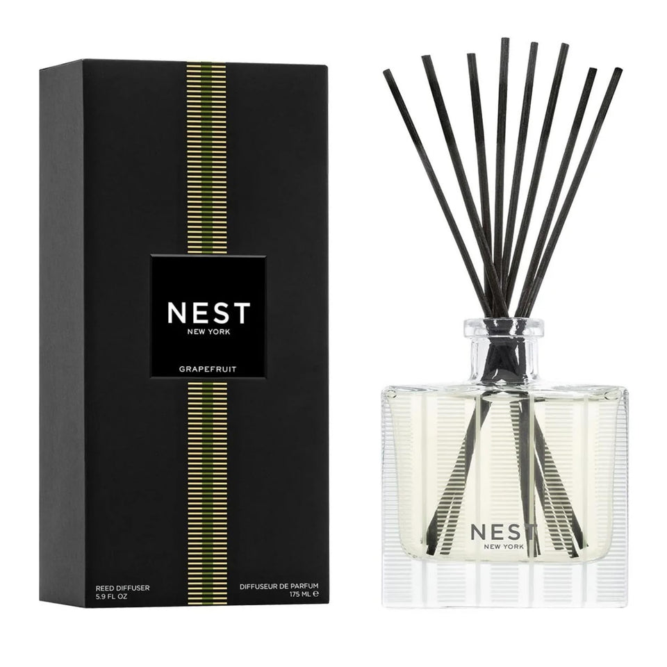 NEST New York Reed Diffuser bottle releasing grapefruit aroma for a subtle home fragrance.