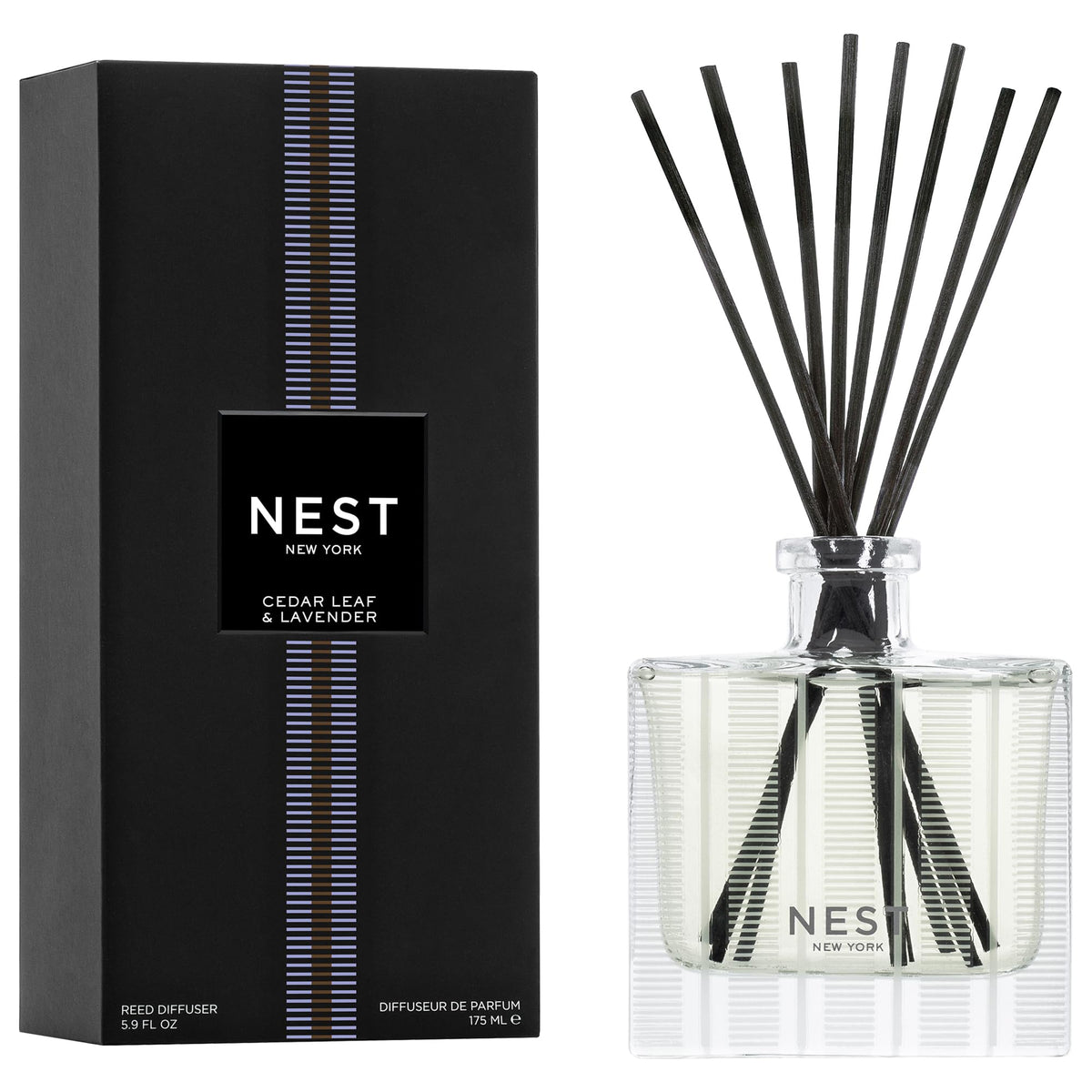 NEST New York Reed Diffuser bottle on a clear glass holder for a serene living space.