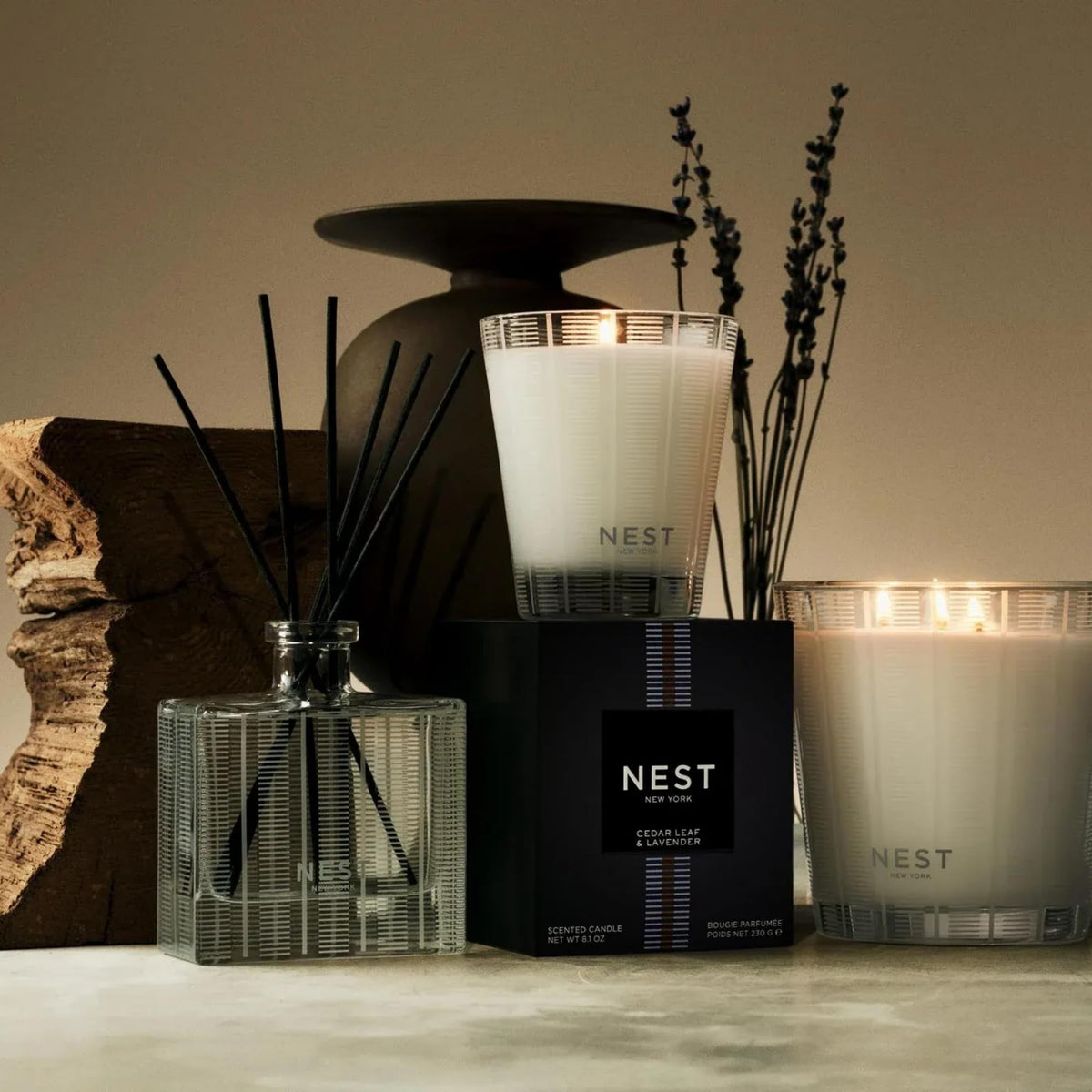 NEST New York glass diffuser vessel showcasing eight natural reed sticks.