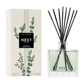 Nest New York reed diffuser in wild mint and eucalyptus on a shelf delivering long-lasting fragrance.