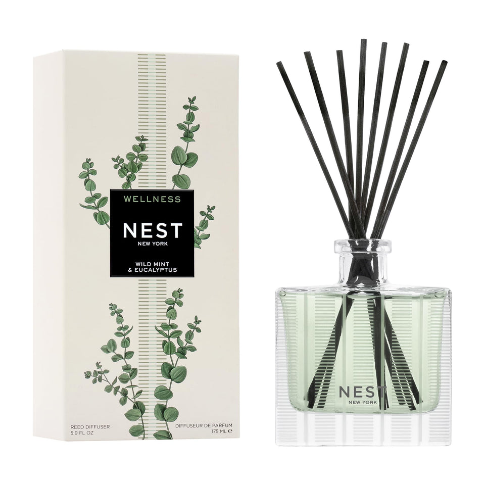 Nest New York reed diffuser in wild mint and eucalyptus on a shelf delivering long-lasting fragrance.