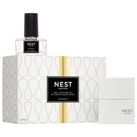 Nest New York Wall Diffuser unit plugged into outlet delivering continuous grapefruit fragrance.