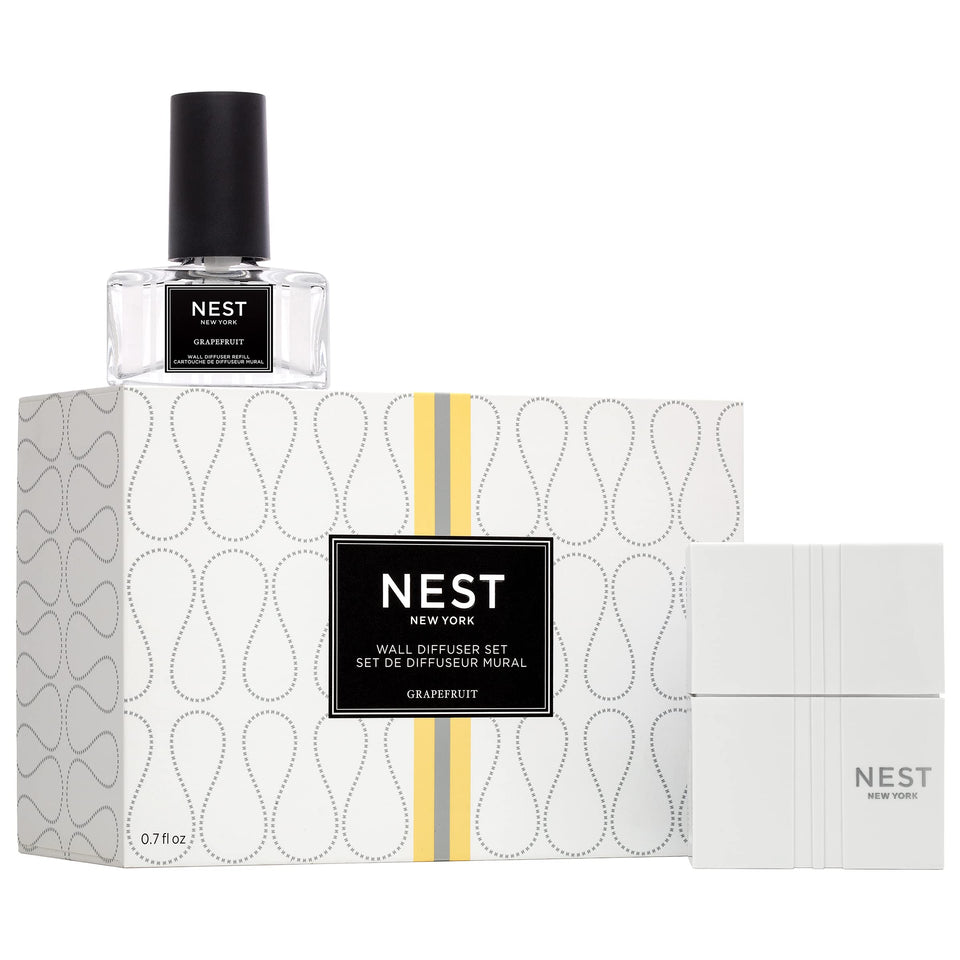 Nest New York Wall Diffuser unit plugged into outlet delivering continuous grapefruit fragrance.