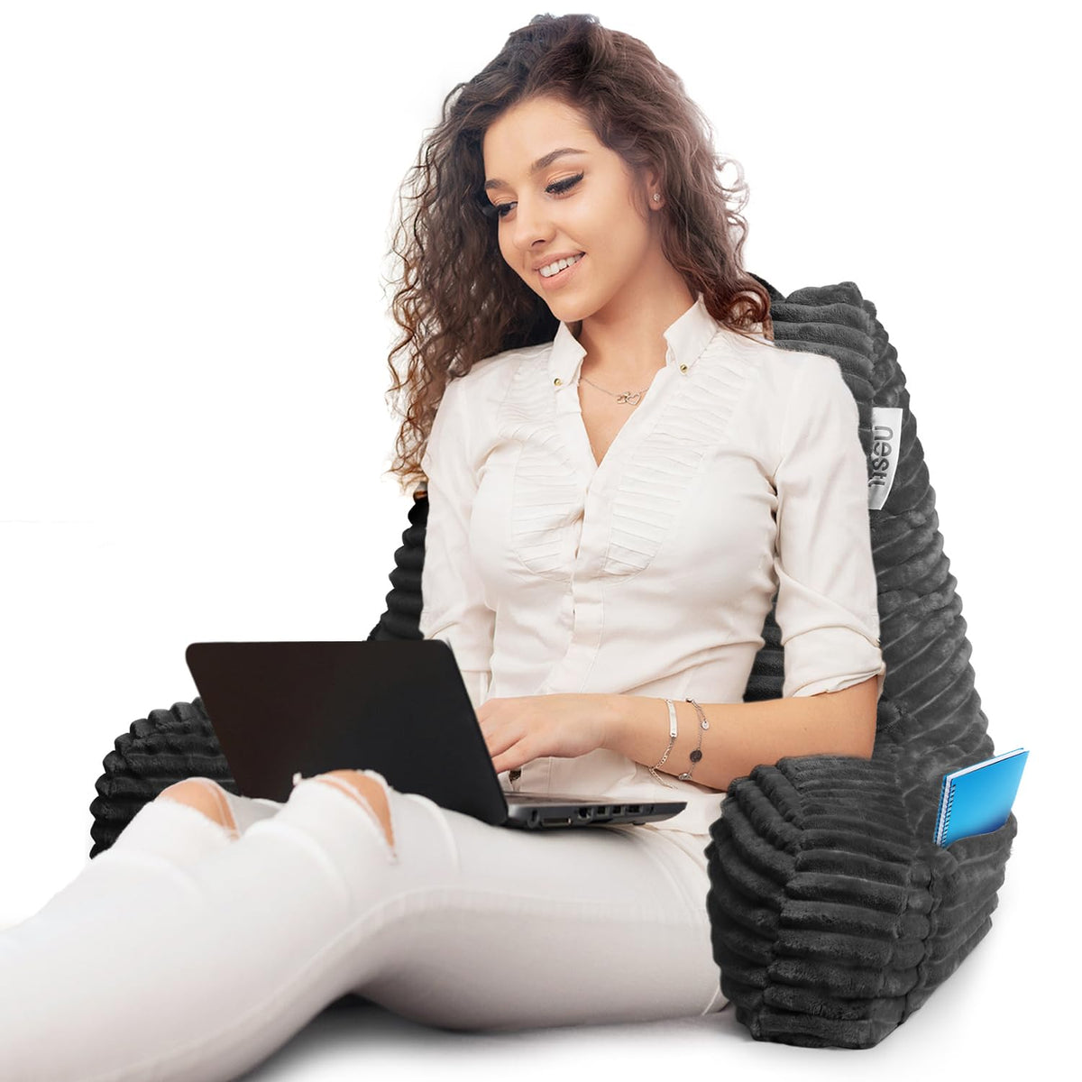 Nestl reading pillow large back pocket holds tablets or books.