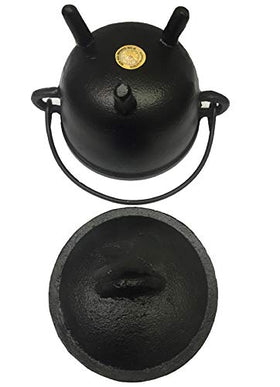 New Age Imports cauldron used as candle holder, decorative and versatile.
