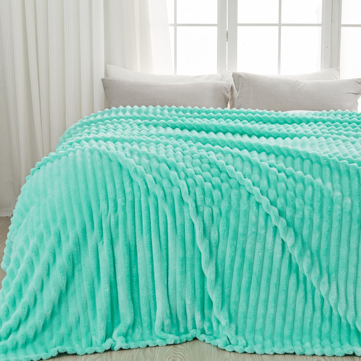 Newcosplay Aqua Ribbed Throw Blanket lifestyle shot in a cozy living space