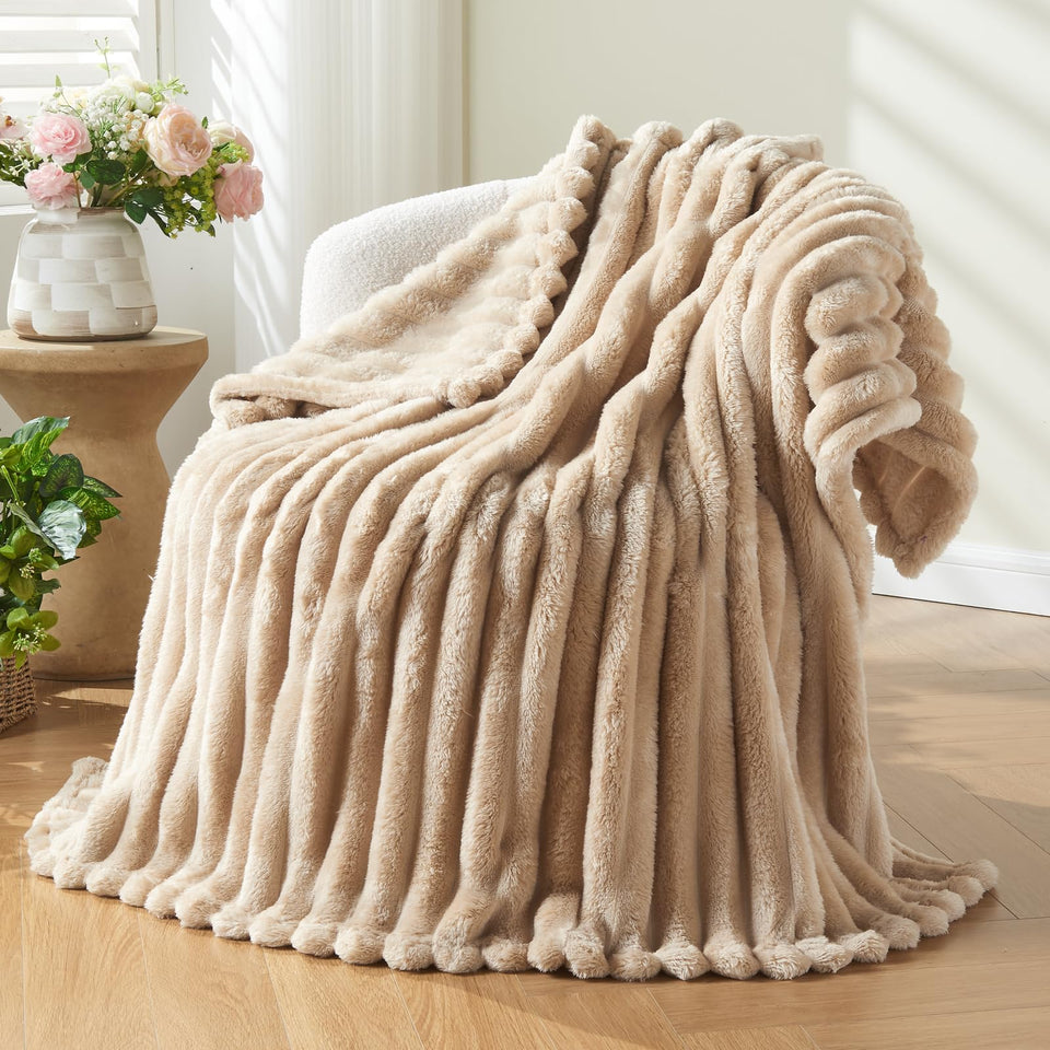 NEWCOSPLAY brown ribbed 3D jacquard twin blanket folded for warmth.
