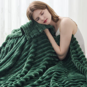 NEWCOSPLAY dark green ribbed throw on sofa adding warmth