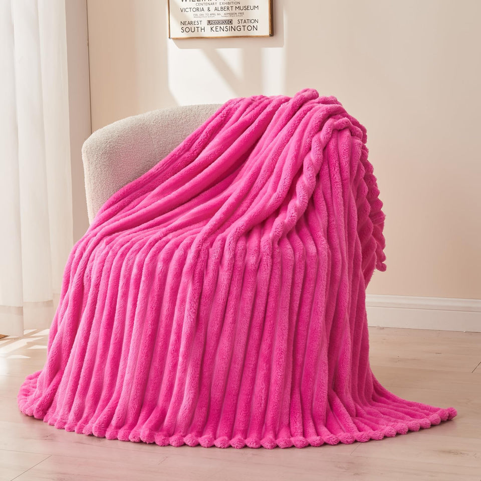 NEWCOSPLAY hot pink ribbed throw blanket on white background for all-season warmth