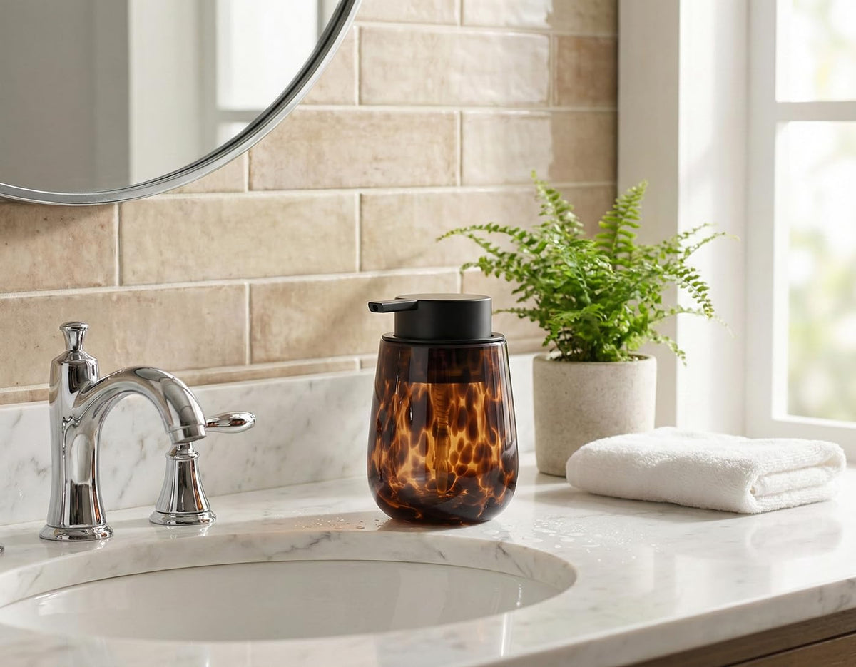 NEWHENGS amber pump close-up shows durable glass and easy refilling for bathrooms.