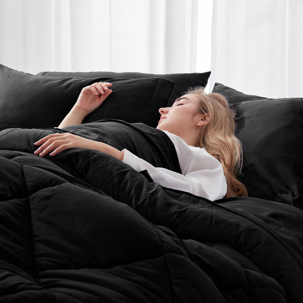 Newspin Queen Comforter Set Black breathable fabric supports cooler, comfortable nights.