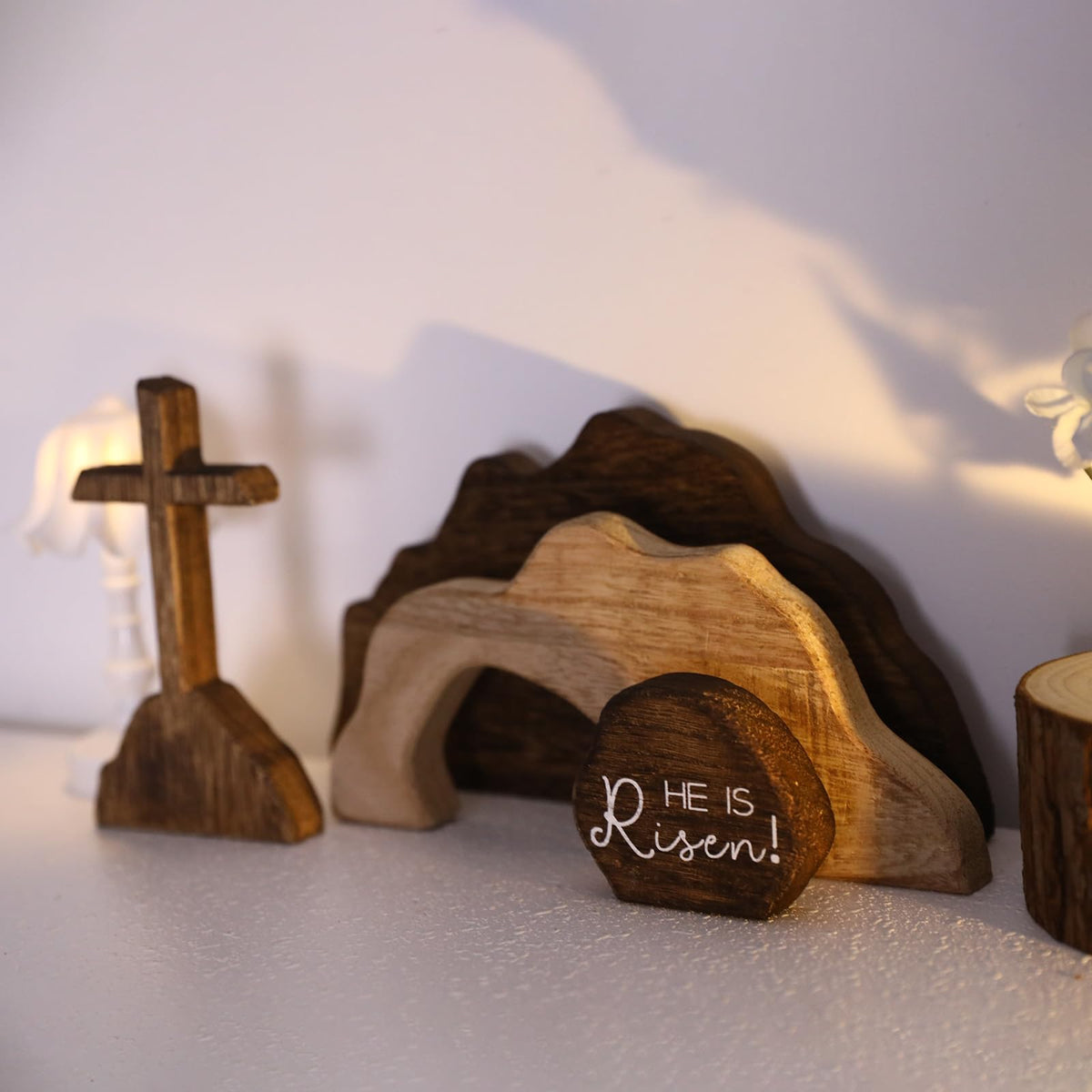 nezababycos cross and he is risen wooden decor highlights faith-centric focal point on shelves.