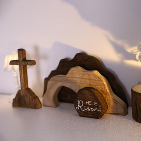 nezababycos cross and he is risen wooden decor highlights faith-centric focal point on shelves.