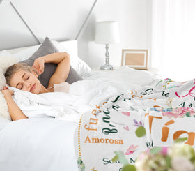 Nicetous Tia blanket folded on sofa highlighting soft-touch comfort.