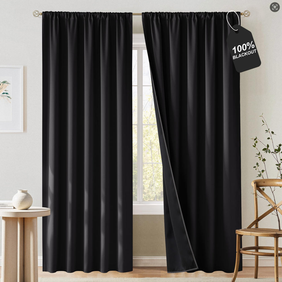 NICETOWN 100% blackout curtains for living room block sunlight for better daytime viewing.