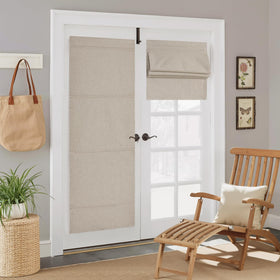 NICETOWN 100% blackout linen door curtain assembly on a door frame for darkness.