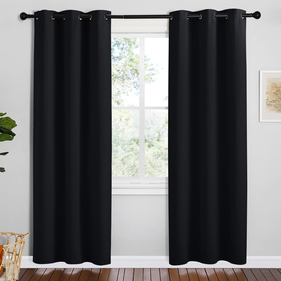 NICETOWN blackout curtains two-panel set blocking light for a cooler room.