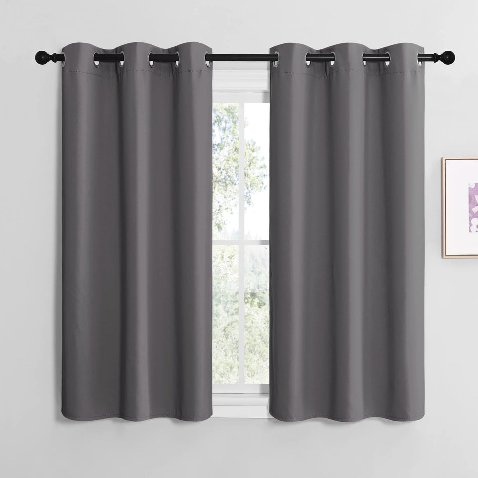 NICETOWN bedroom blackout curtains with silver grommets block light for restful mornings.