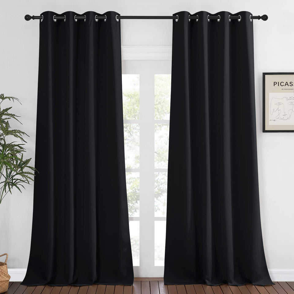 NICETOWN blackout curtain front view with grommets blocks light for privacy.