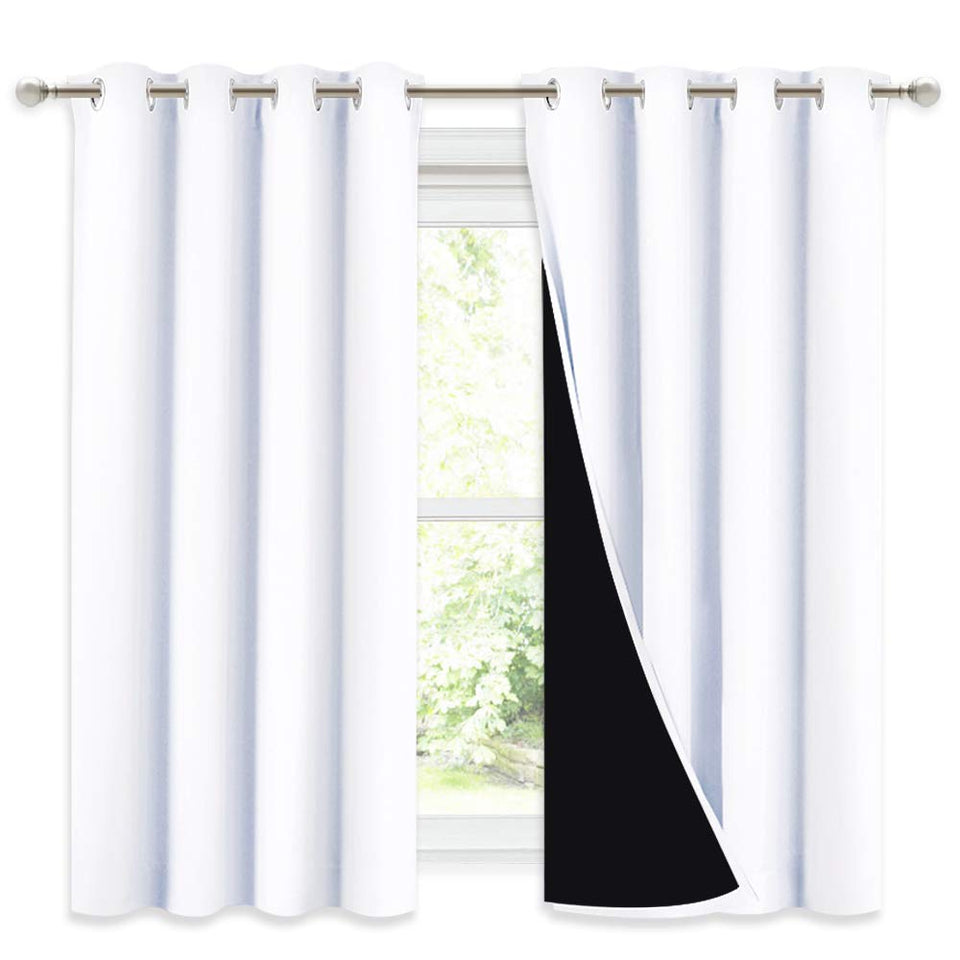 NICETOWN blackout curtain panel close-up of the grommet for easy installation and privacy.