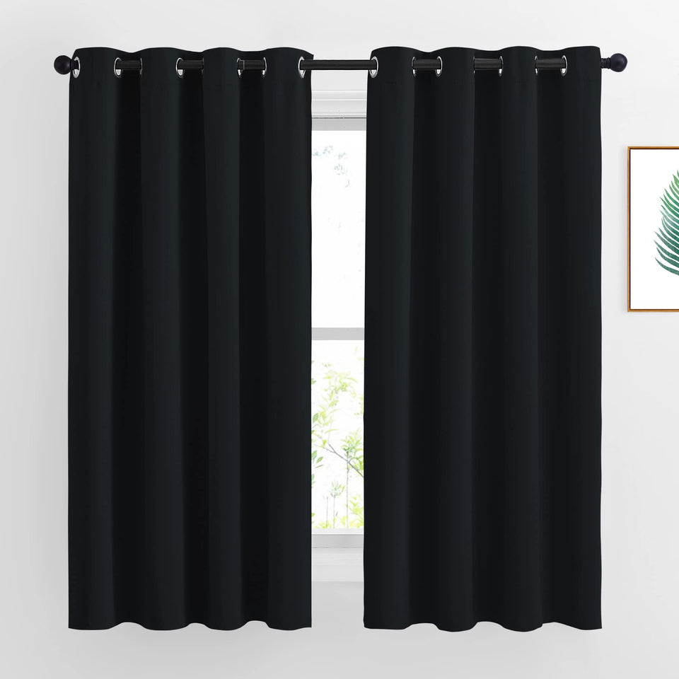 NICETOWN burgundy blackout curtains closeup fabric showing strong light blocking.
