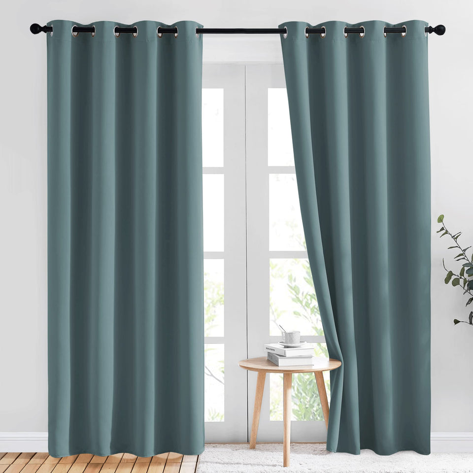 NICETOWN greyish-blue blackout curtains block light and boost privacy in living rooms.