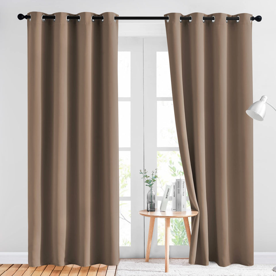 NICETOWN blackout curtain panel (52x84) in cappuccino softly blocks light for a restful bedroom.