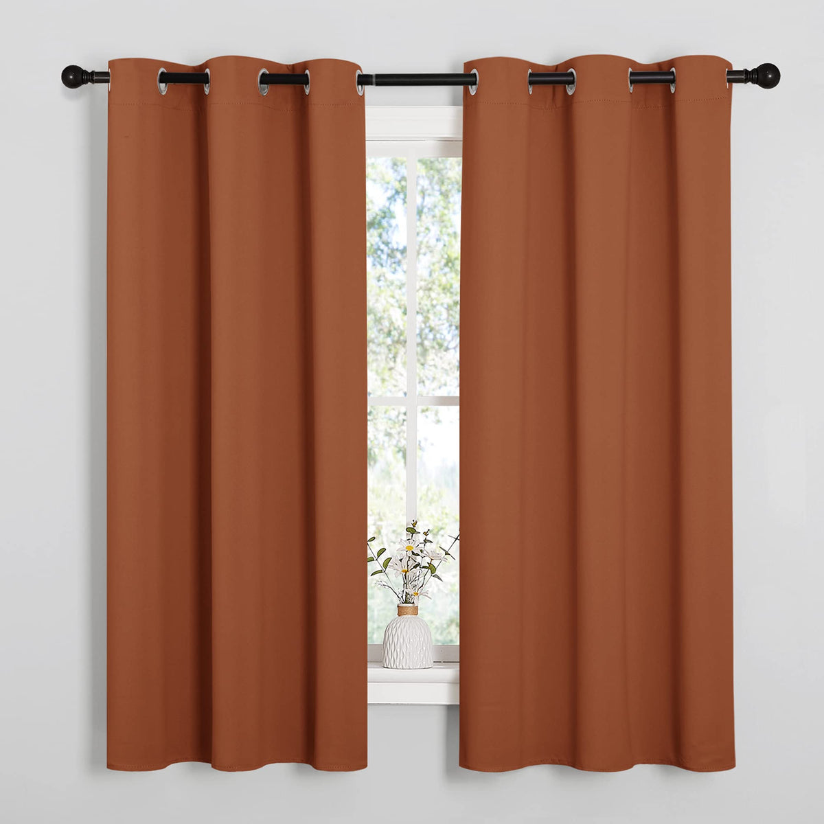 Nicetown burnt orange blackout curtains with privacy and light control in a bedroom