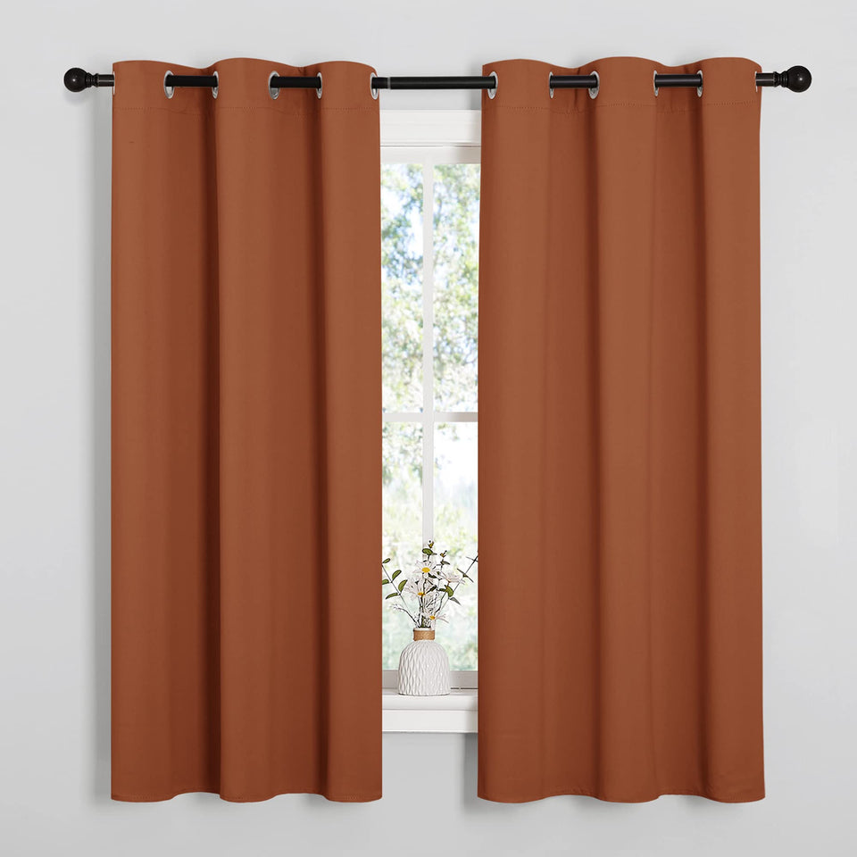 Nicetown burnt orange blackout curtains with privacy and light control in a bedroom
