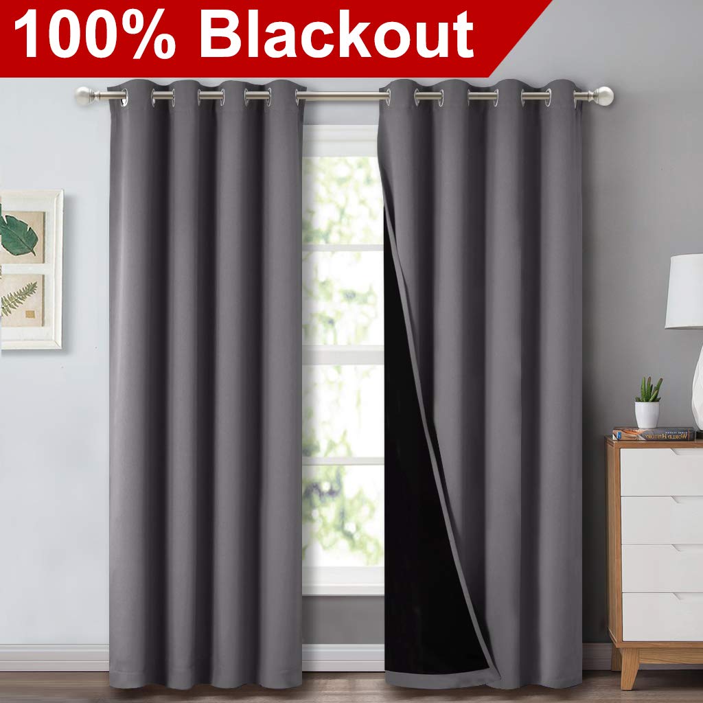 NICETOWN grey full shade panel on rod demonstrates light-blocking capability