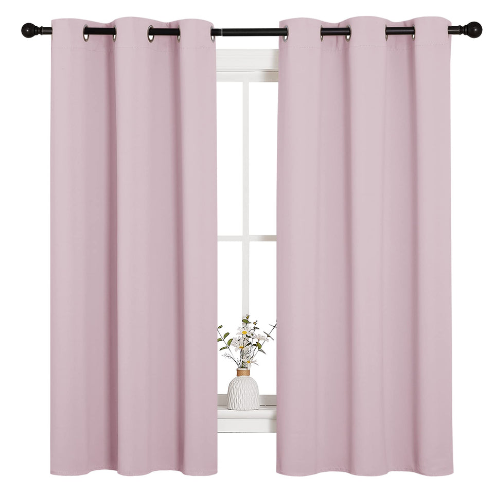 NICETOWN nursery baby-pink curtains folded, showcasing soft texture for a cozy nursery ambience.