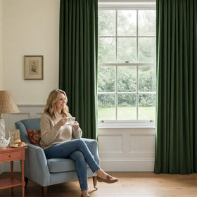 NICETOWN olive green velvet curtains in a living room elevate decor and acoustics