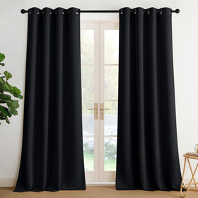 NICETOWN room darkening curtains in black with silver grommets enhance privacy and modern room look.