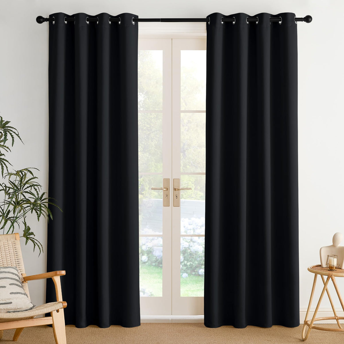 NICETOWN room darkening draperies in black 52x84 block light and provide privacy.