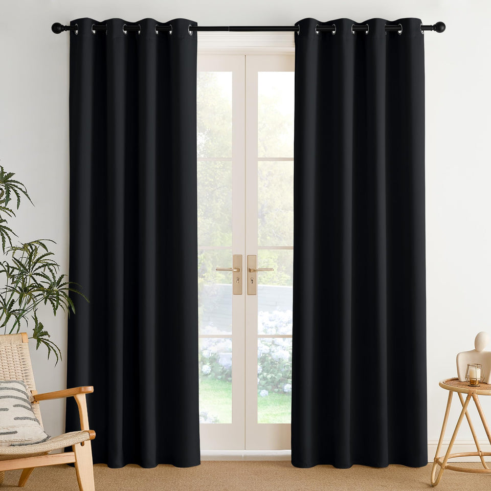 NICETOWN room darkening draperies in black 52x84 block light and provide privacy.