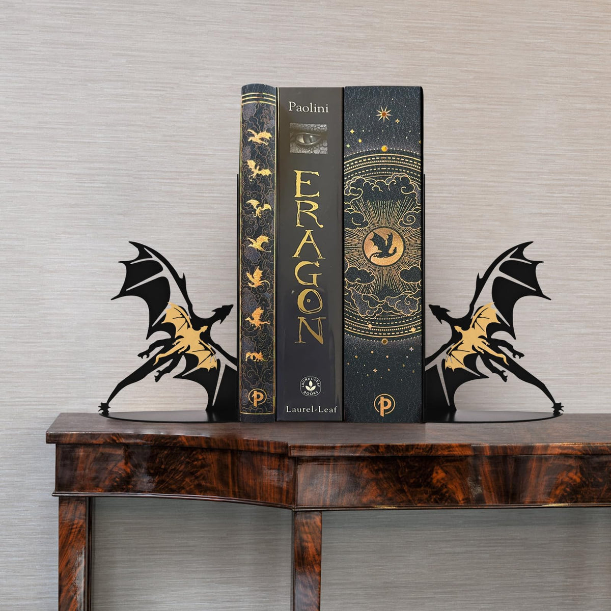 Nichake dragon bookends on a desk keeping magazines upright