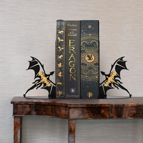 Nichake dragon bookends on a desk keeping magazines upright
