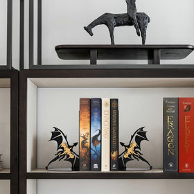 Nichake dragon silhouette bookends enhancing a bookshelf display