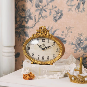 NIKKY HOME vintage tabletop clock in gold, side view showing compact footprint