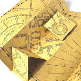 The Noble Collection Marauder's Map official licensing badge close-up for authenticity.