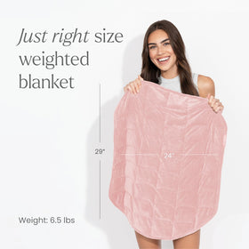 nodpod Body 6.5lb weighted blanket draped on bed for restful evenings