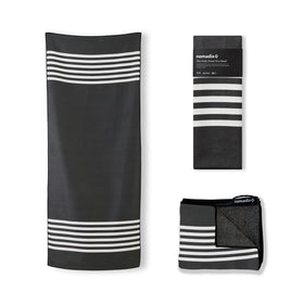 Nomadix Original Towel on the beach scene, quick-dry and sand-resistant for easy cleanup.