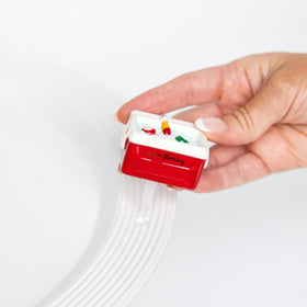 Nora Fleming hand-painted summer mini with an interchangeable base enhances tabletop décor.